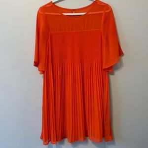 Stunning flowy coral dress perfect for a summer wedding